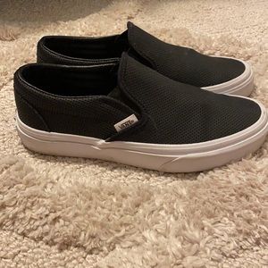 Size 7.0 black and white Vans.